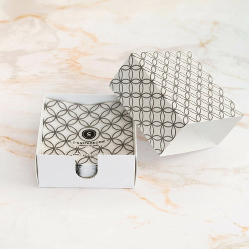 Box of C-Gastronomie cocktail napkins on marble