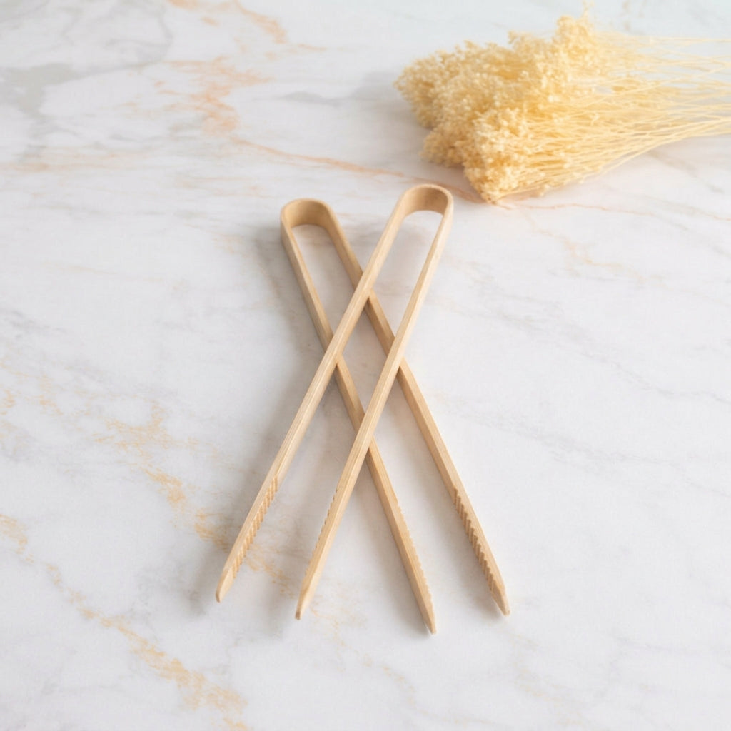 Wooden tongs on marble
