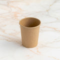 Kraft paper cup 12 cl on marble