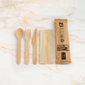 4-in-1 wooden cutlery set on marble