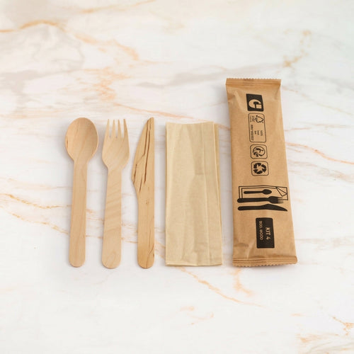 4-in-1 wooden cutlery set on marble
