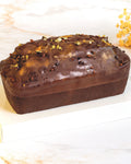 Dark chocolate cake with gold leaf, prepared by C-Gastronomie in Abu Dhabi