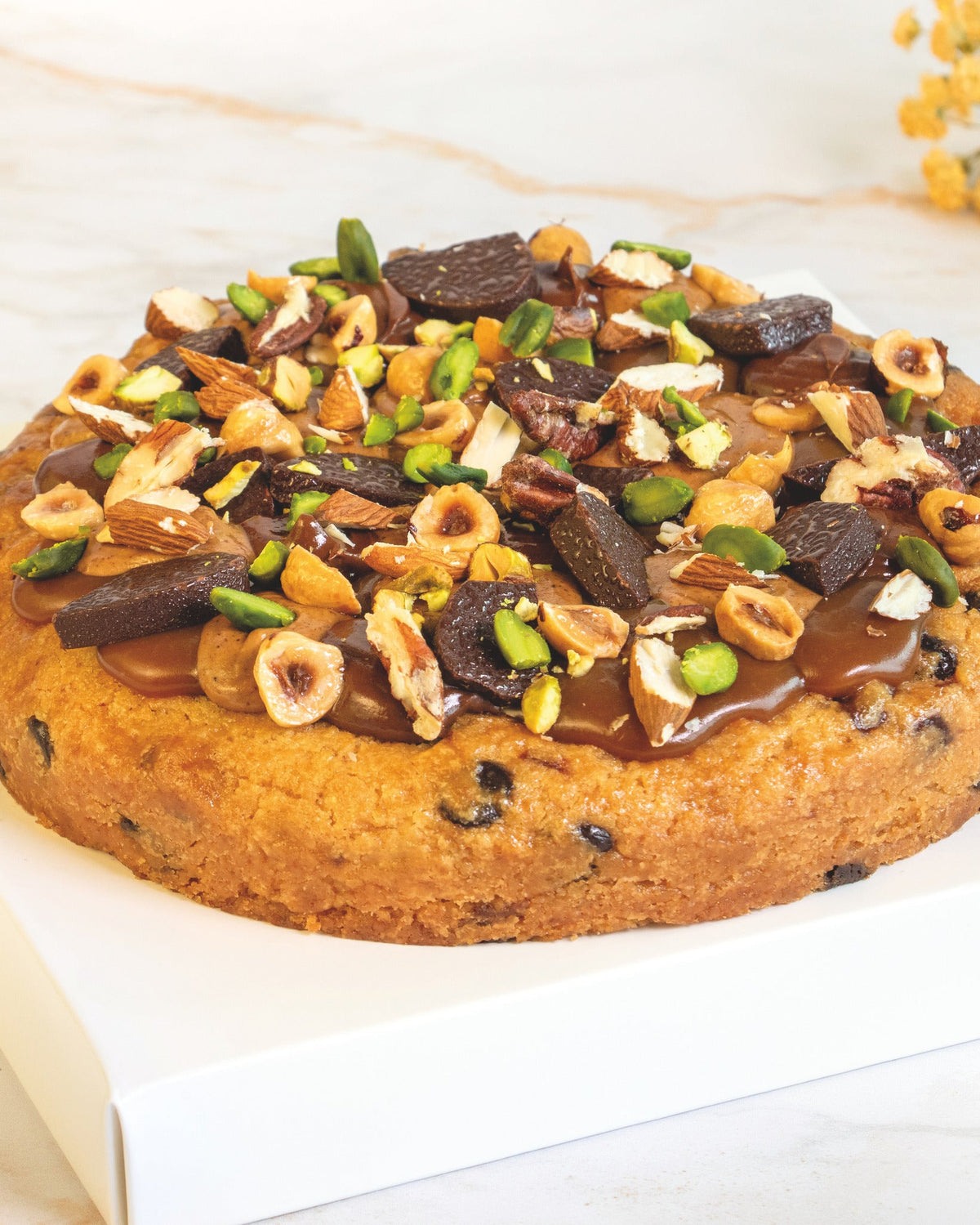Dried fruit and nut mendiant cookies, prepared by C-Gastronomie in Abu Dhabi