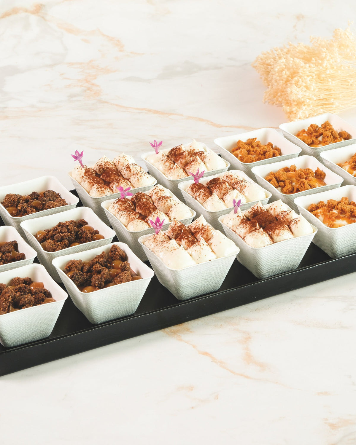 Mixed verrine platter with chocolate mousse, crumble and tiramisu, prepared by C-Gastronomie in Abu Dhabi
