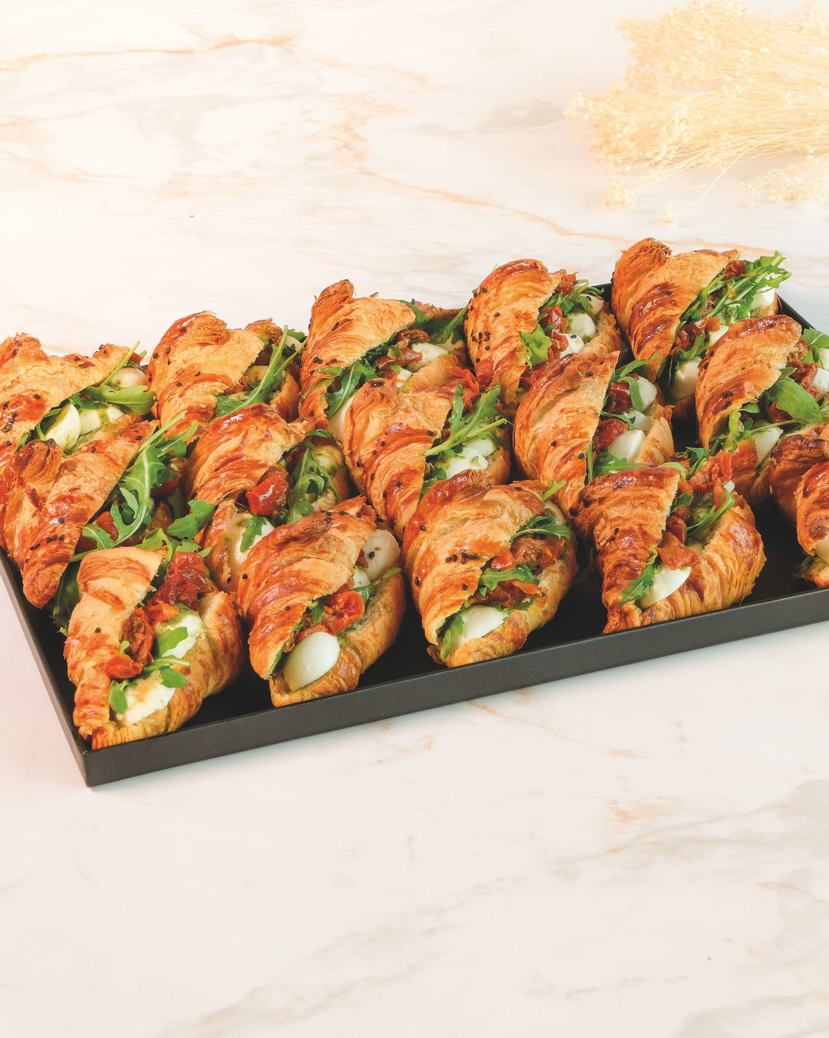 Mozzarella croissant platter, prepared by C-Gastronomie in Abu Dhabi