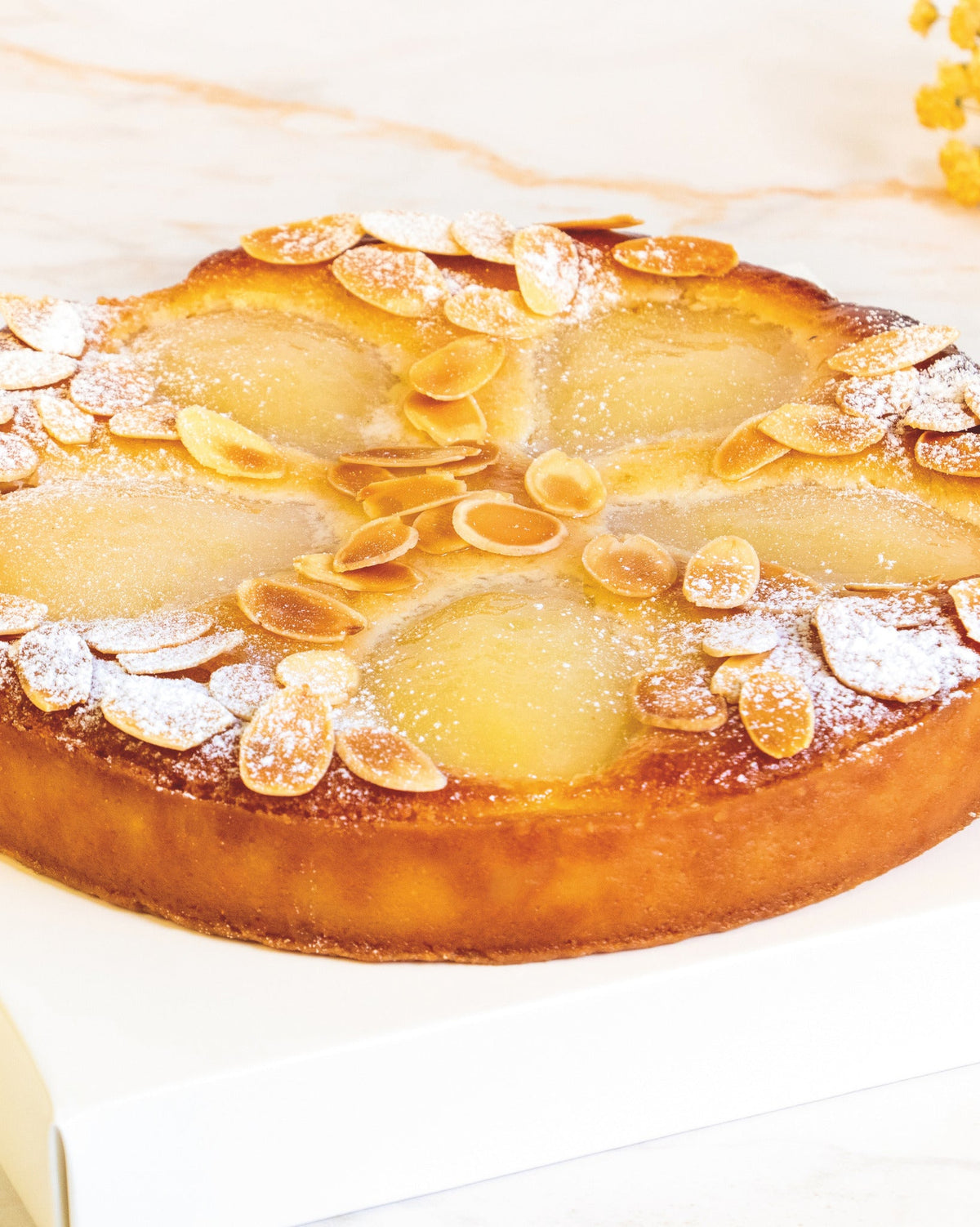 Pear and almond Bourdaloue tart, prepared by C-Gastronomie in Abu Dhabi