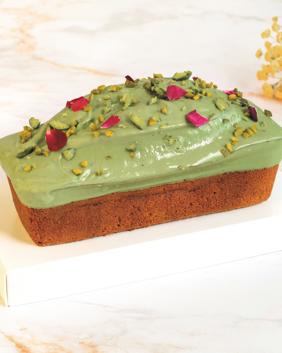 Pistachio and rose petal cake, prepared by C-Gastronomie in Abu Dhabi