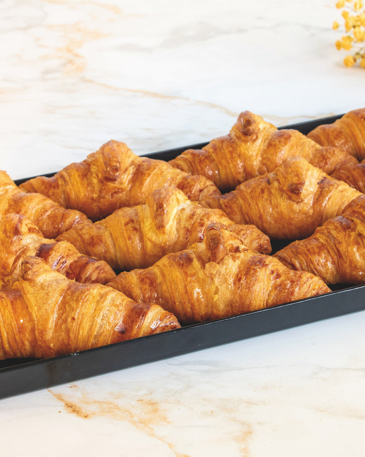 Pure butter croissant platter, prepared by C-Gastronomie in Abu Dhabi