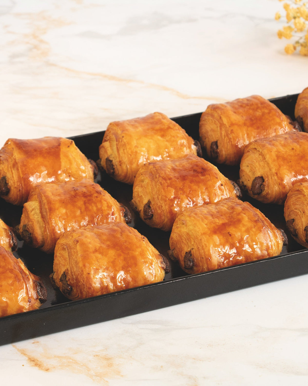 Pure butter pain au chocolat platter, prepared by C-Gastronomie in Abu Dhabi