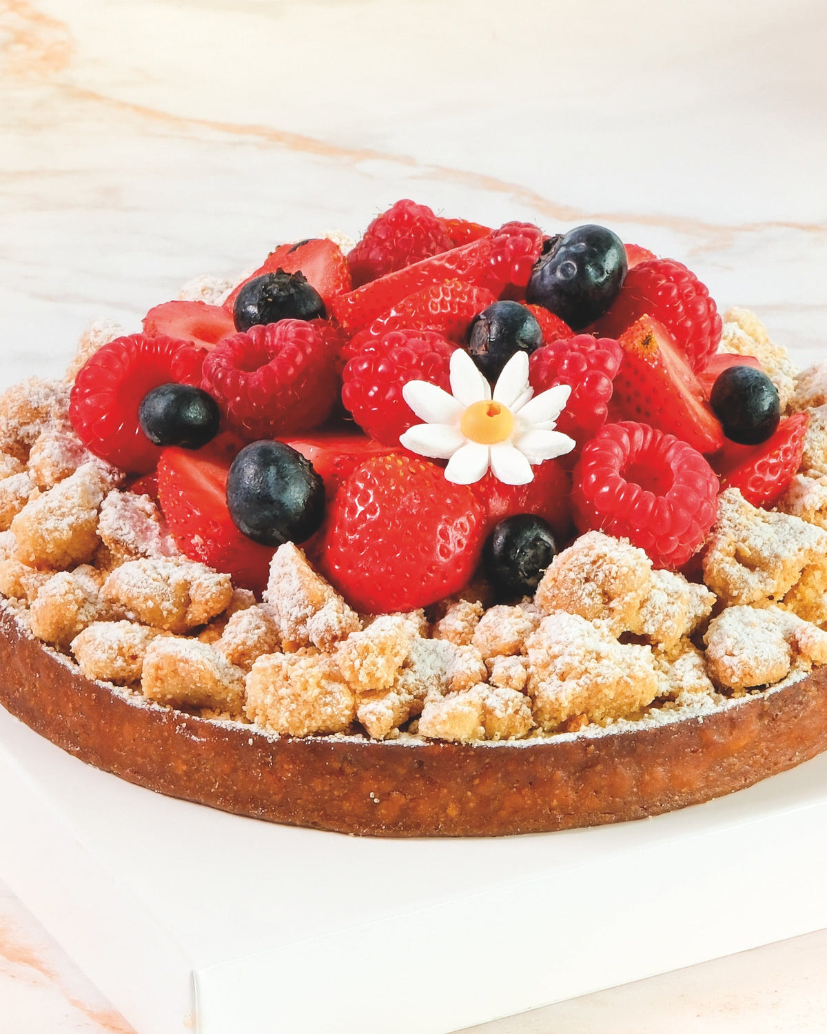 Red berry streusel tart, prepared by C-Gastronomie in Abu Dhabi