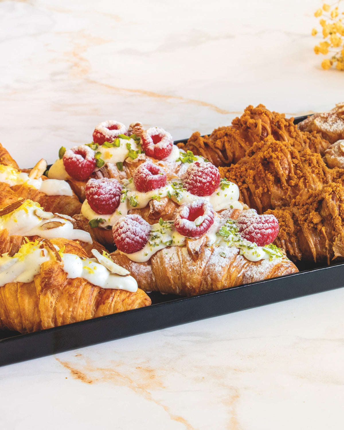 Signature filled croissant platter, prepared by C-Gastronomie in Abu Dhabi